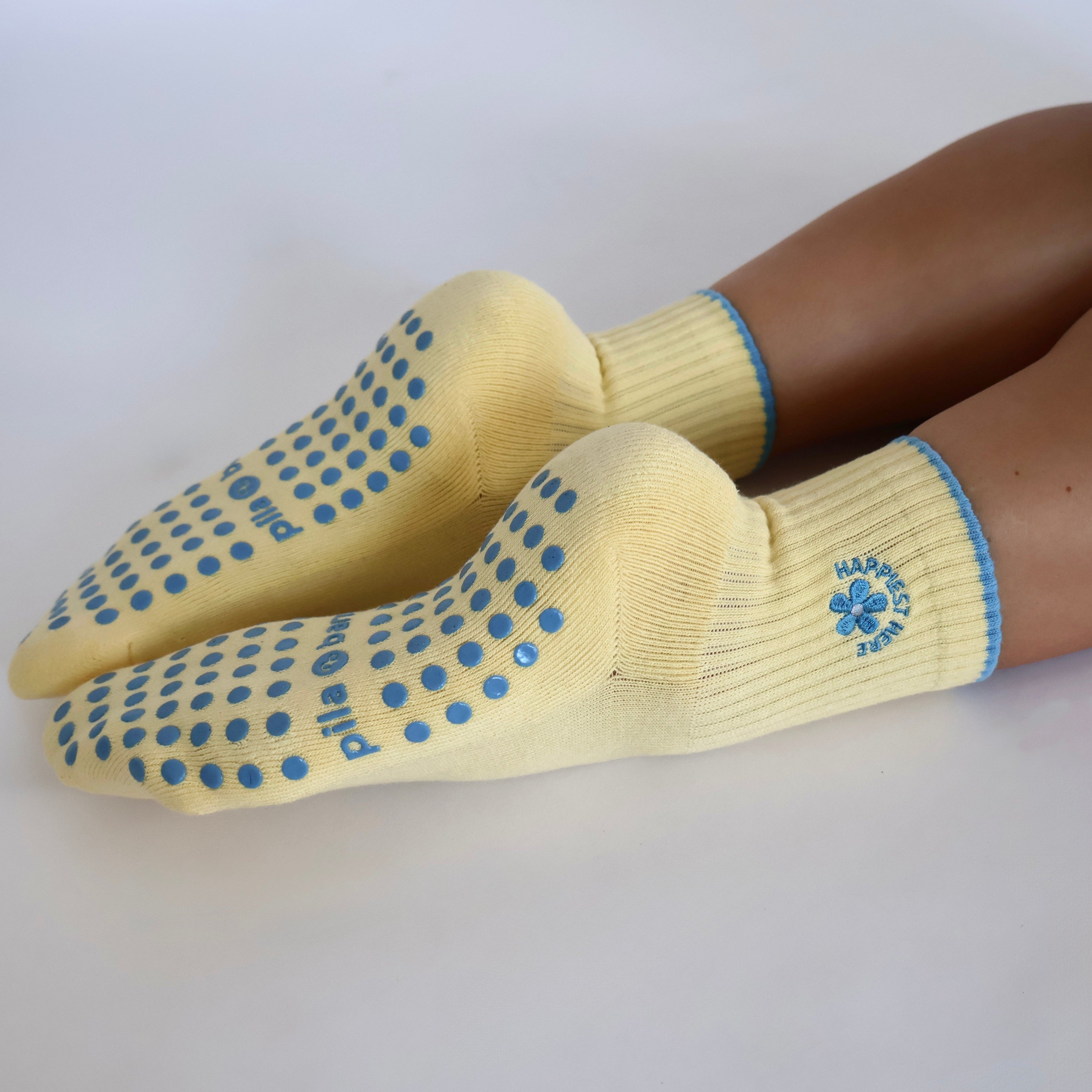 Cute yellow pilates socks with blue designs