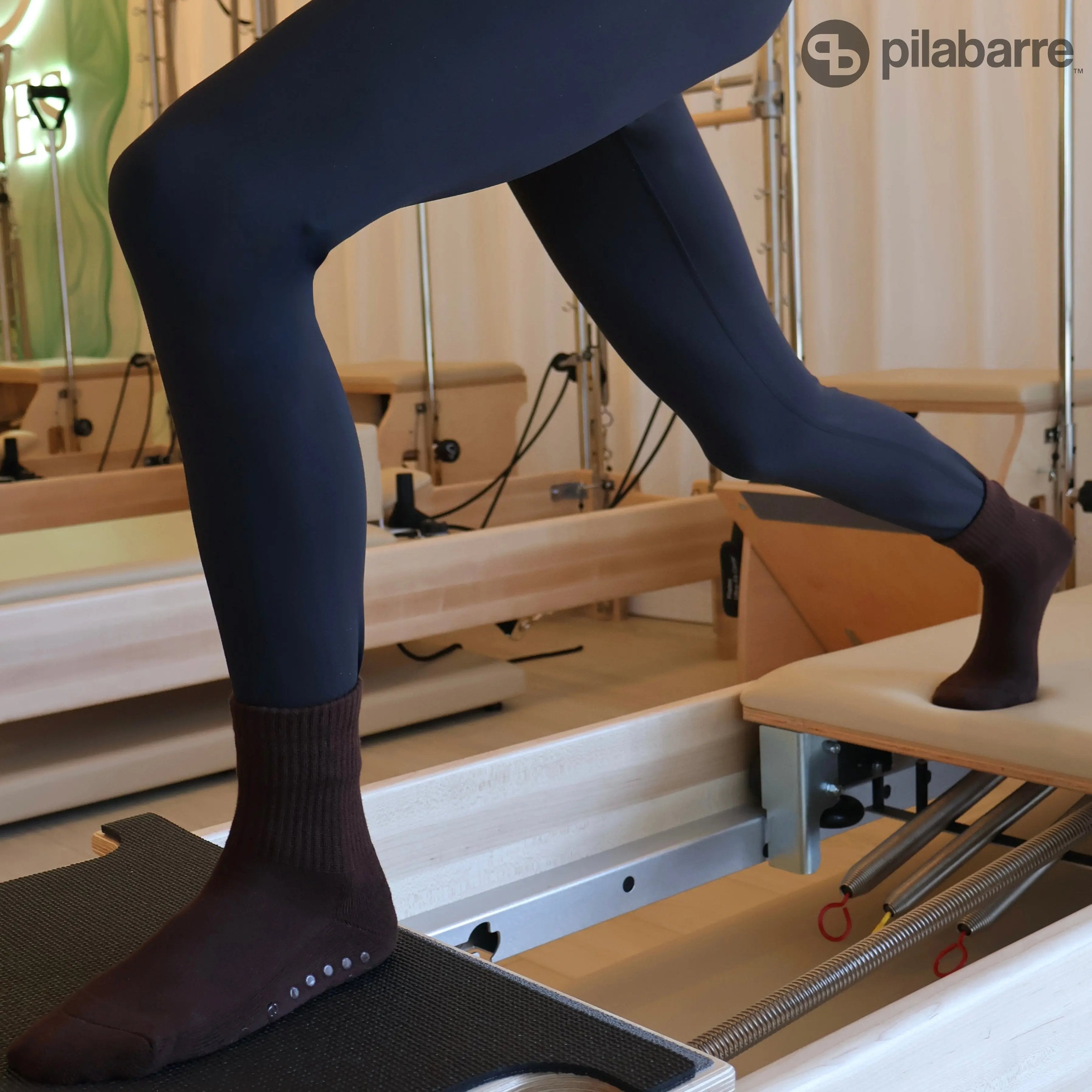 Brown Grip Socks on Pilates Reformer