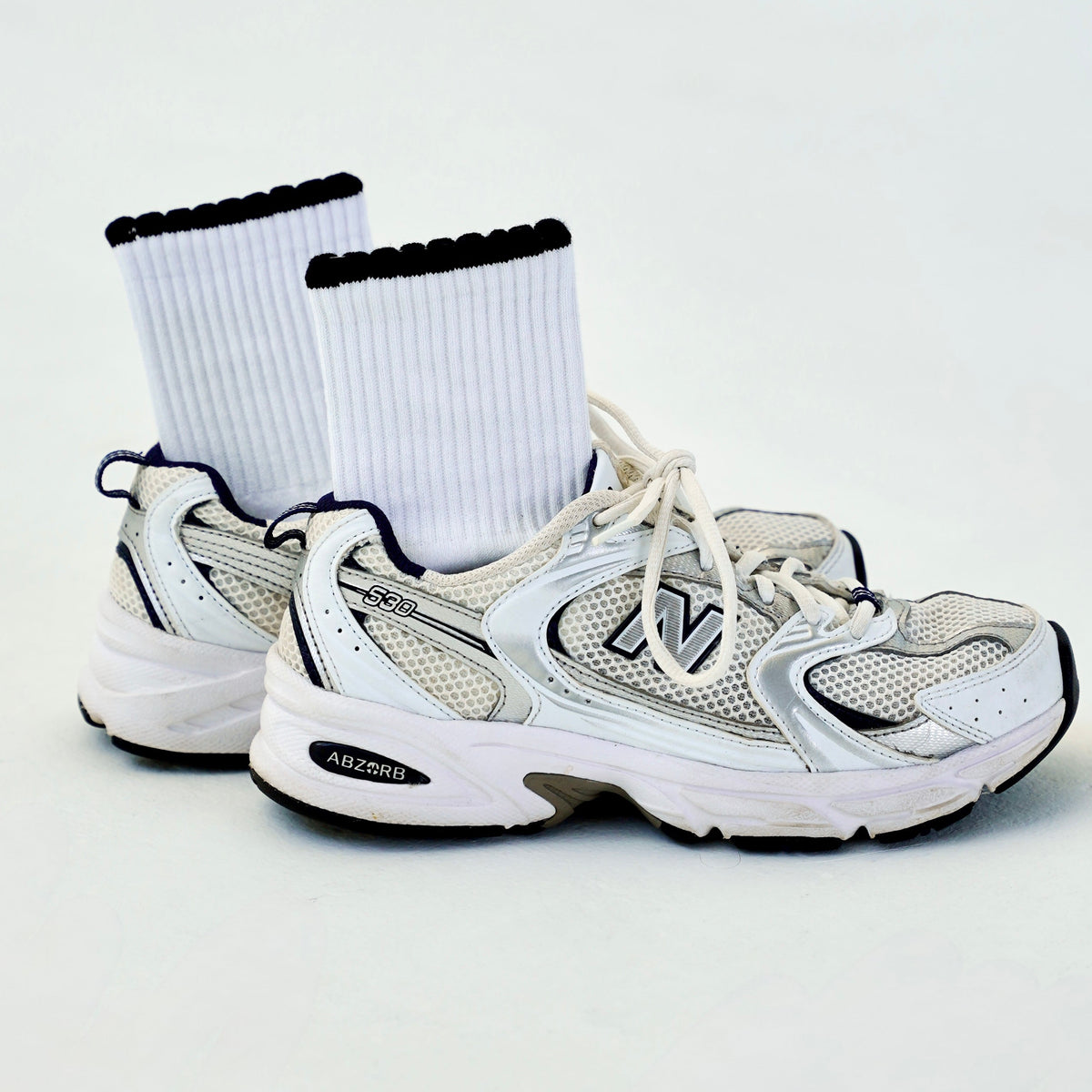 white and black pilates socks with ruffles
