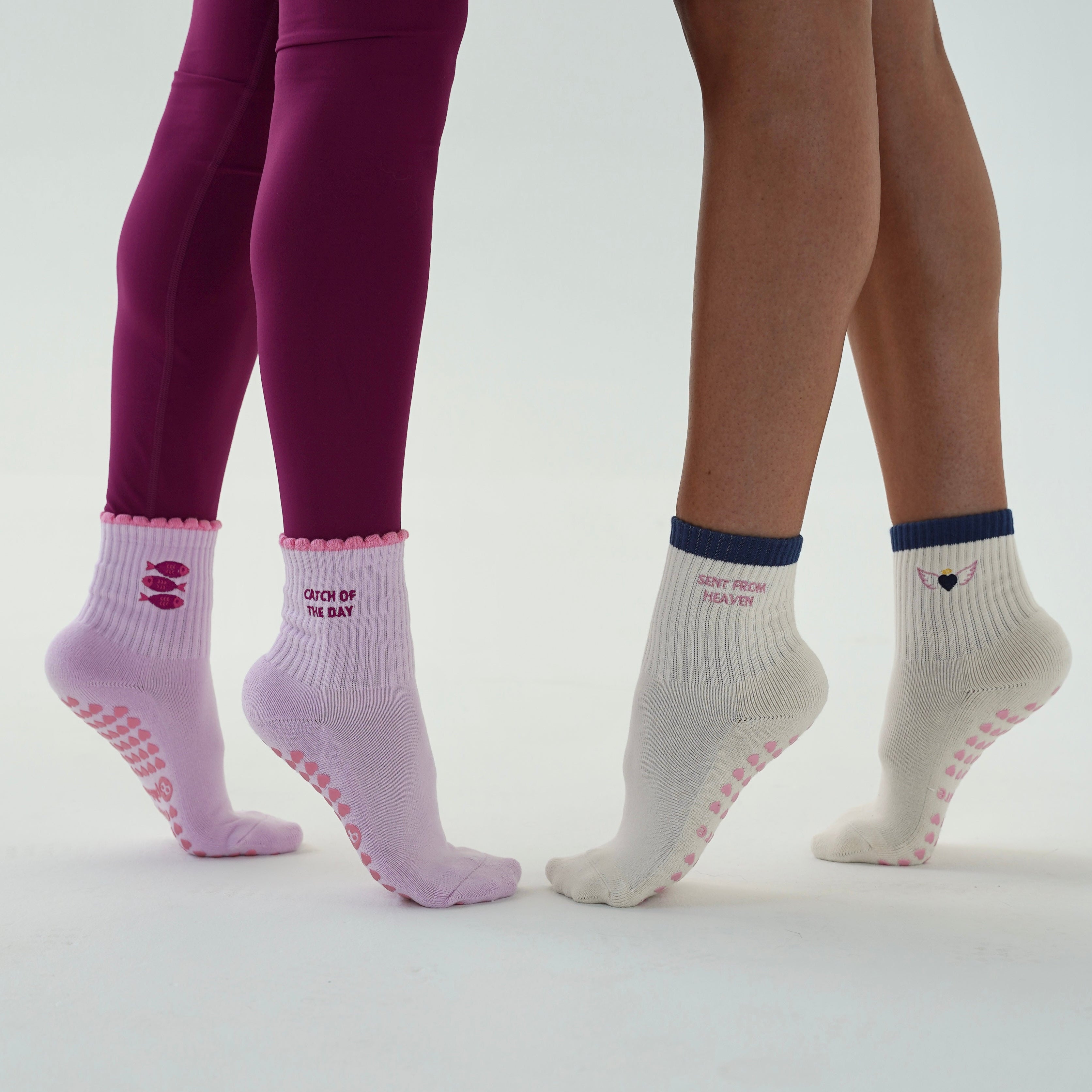 cute grip socks with angel wings and grip socks with sardines. fun pilates socks from pila barre