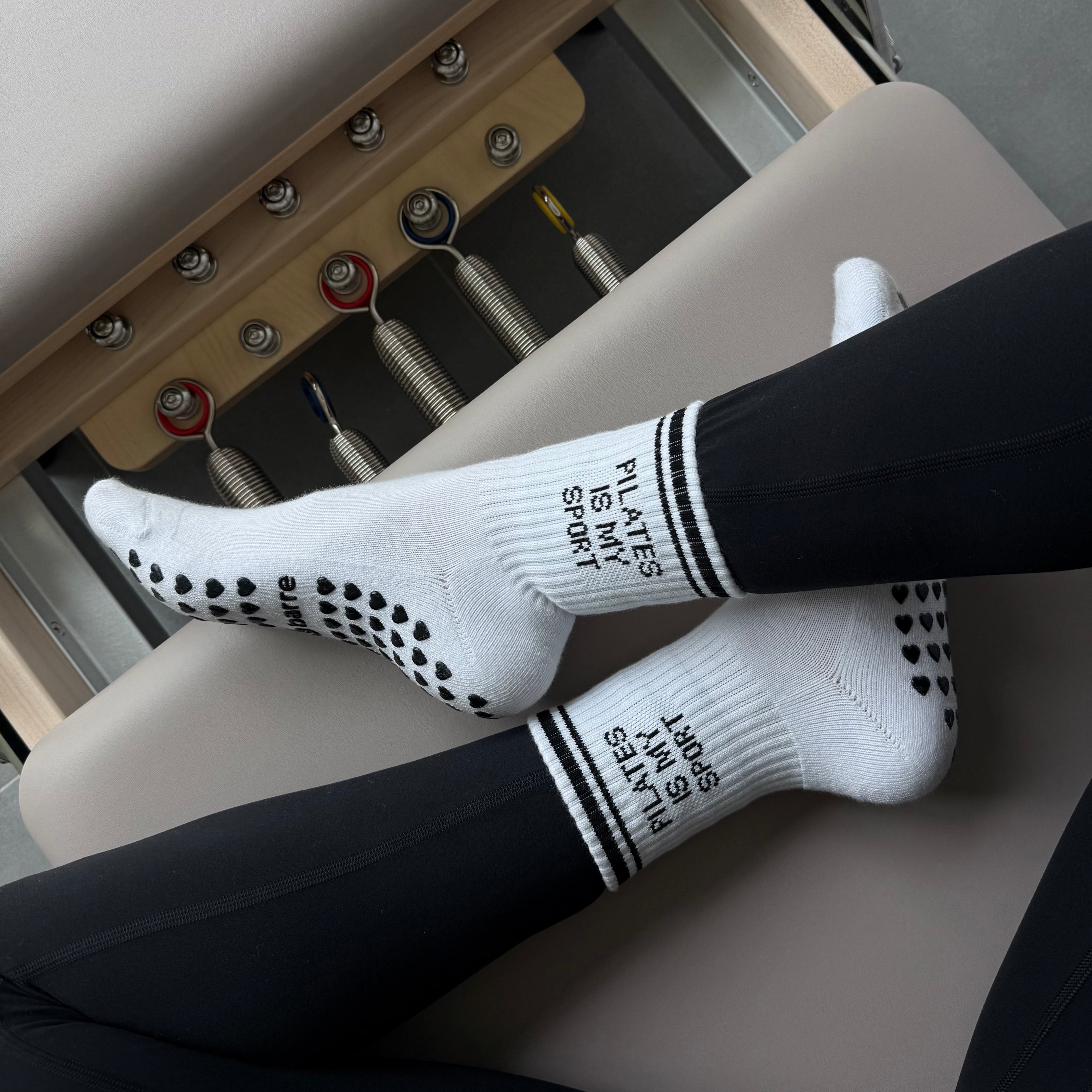 Cute Pilates socks on a reformer