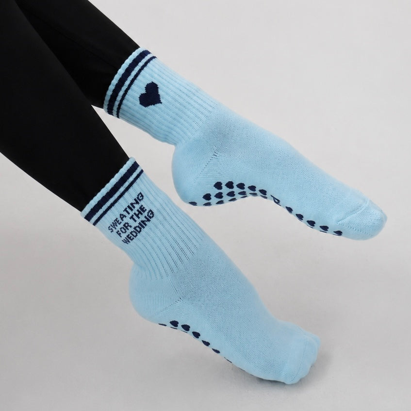 Sweating for the wedding grip socks in blue - on model