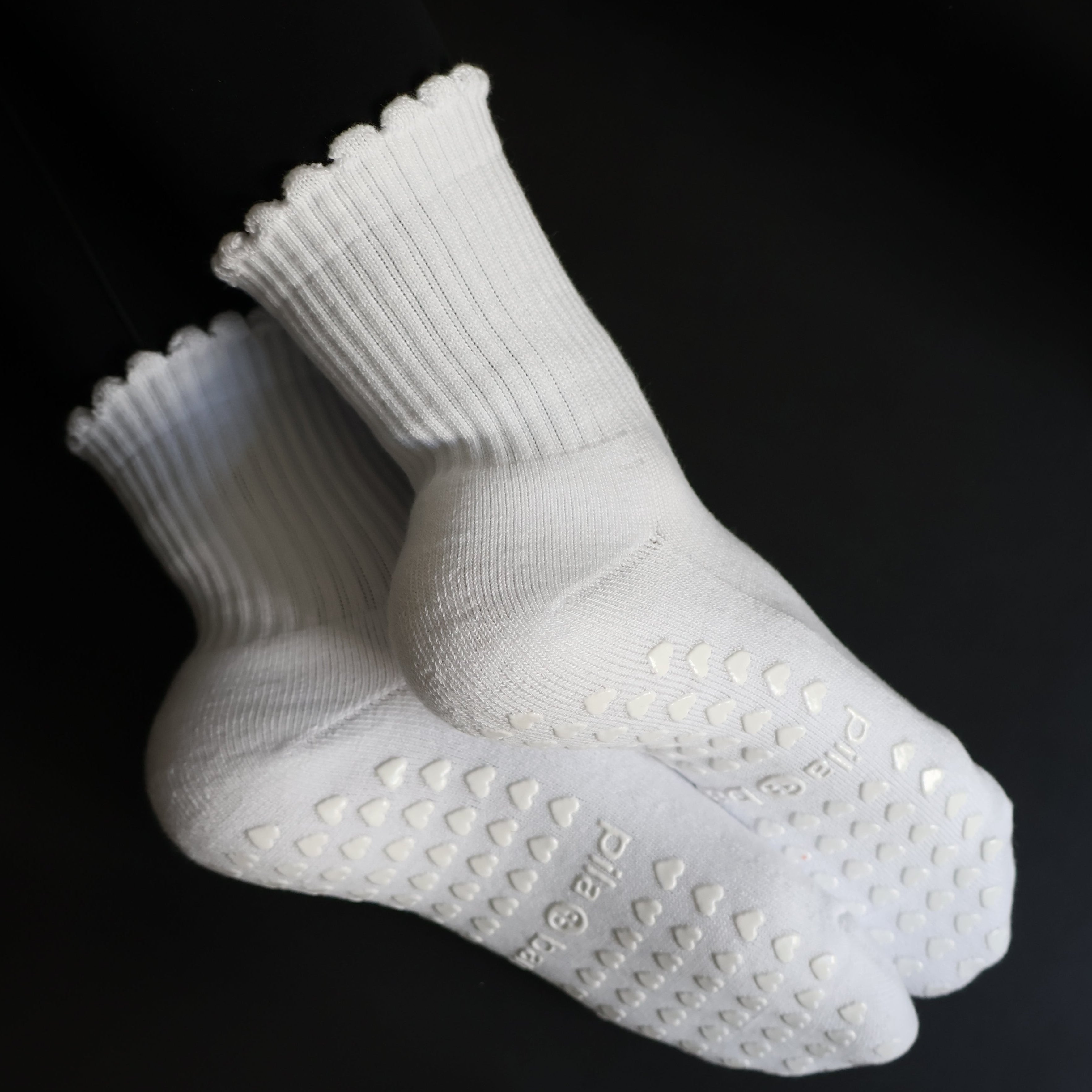 White ruffle grip socks for pilates