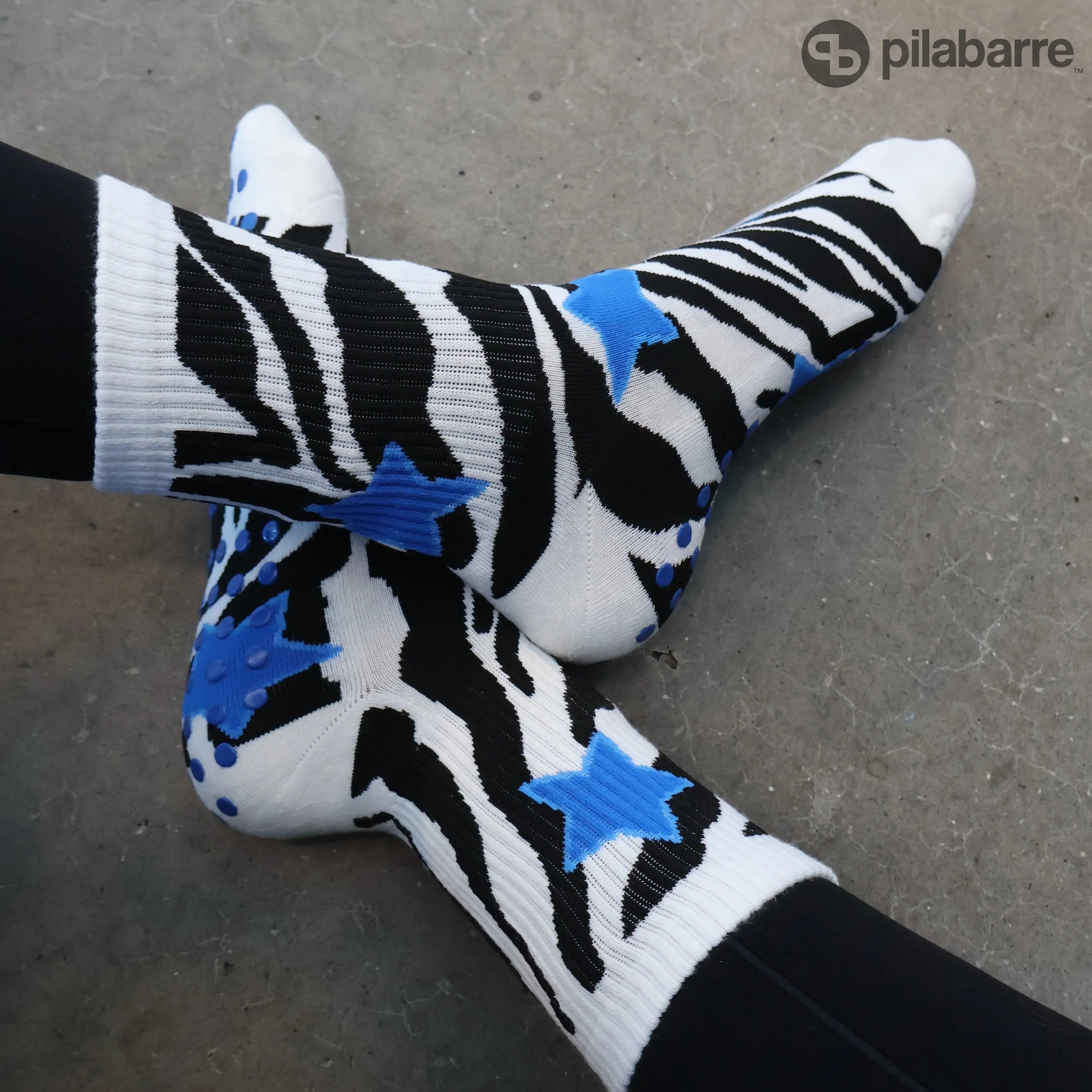 Zebra print grip socks with blue stars