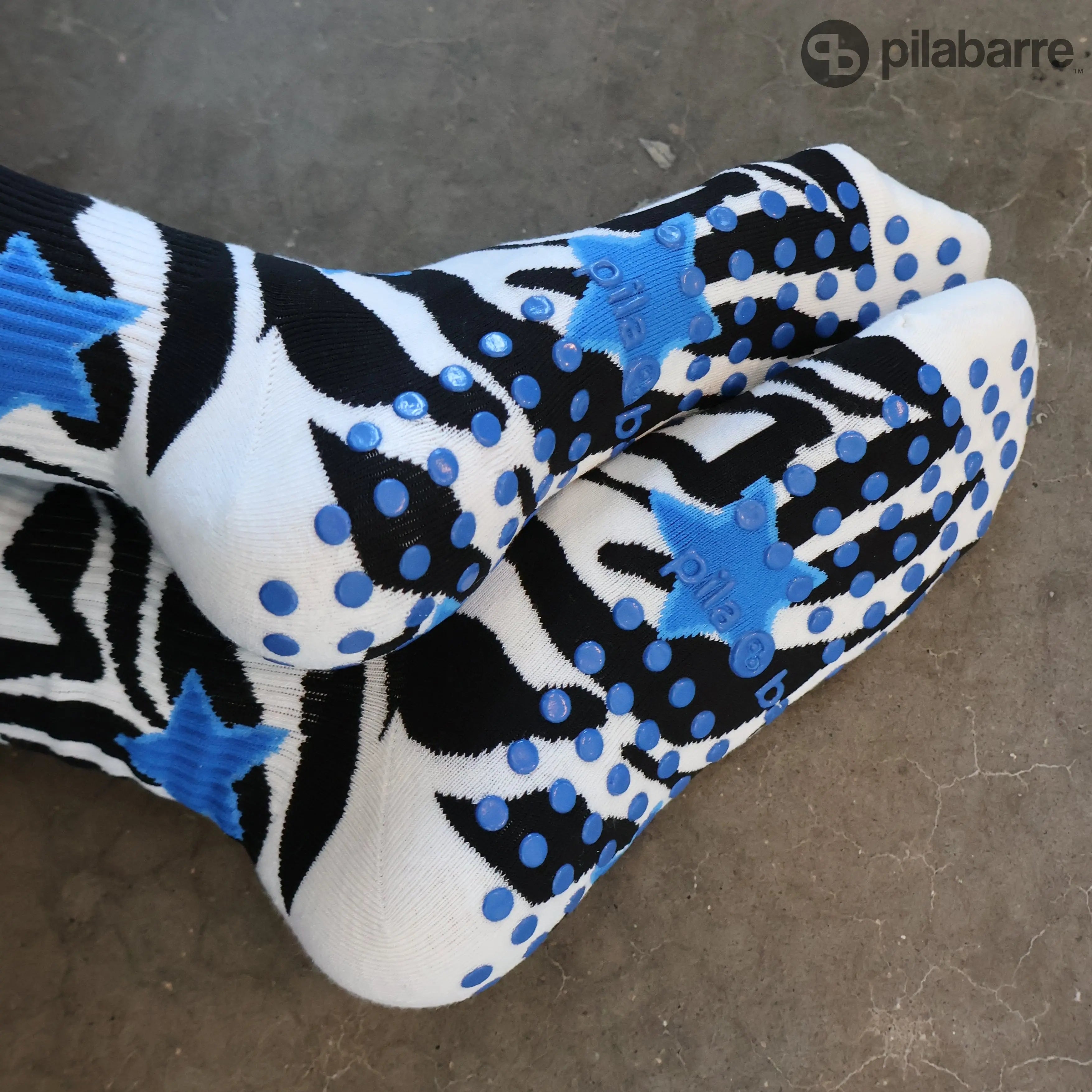 Zebra barre grip socks with blue stars