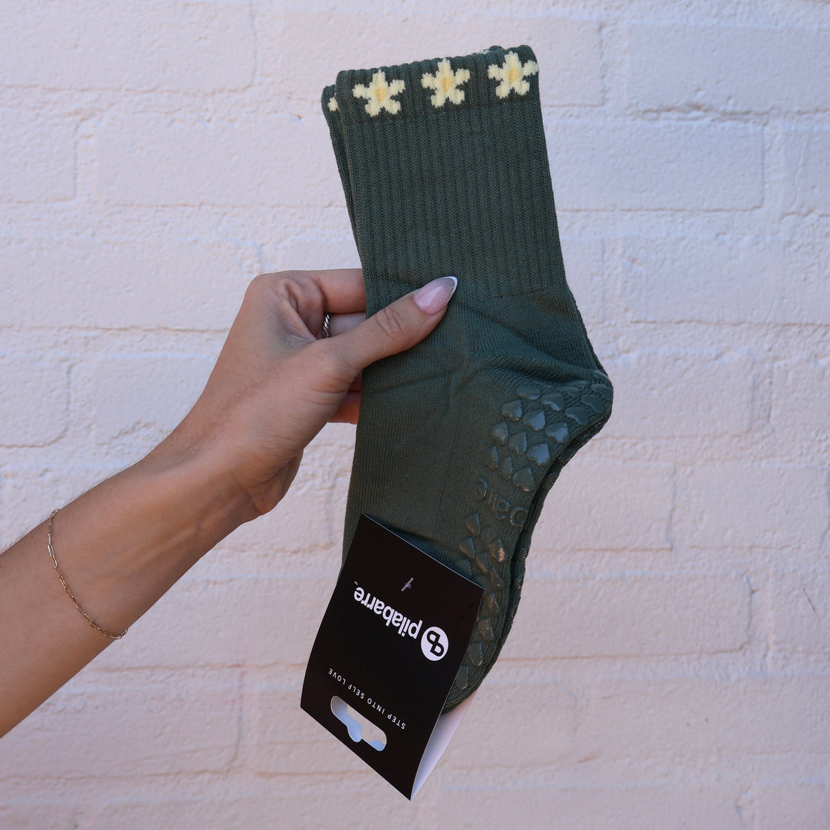 green and yellow flower grip socks for pilates