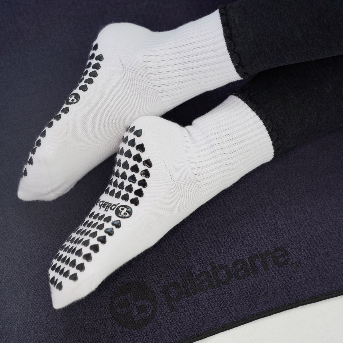 white and black barre socks with a ruffle 