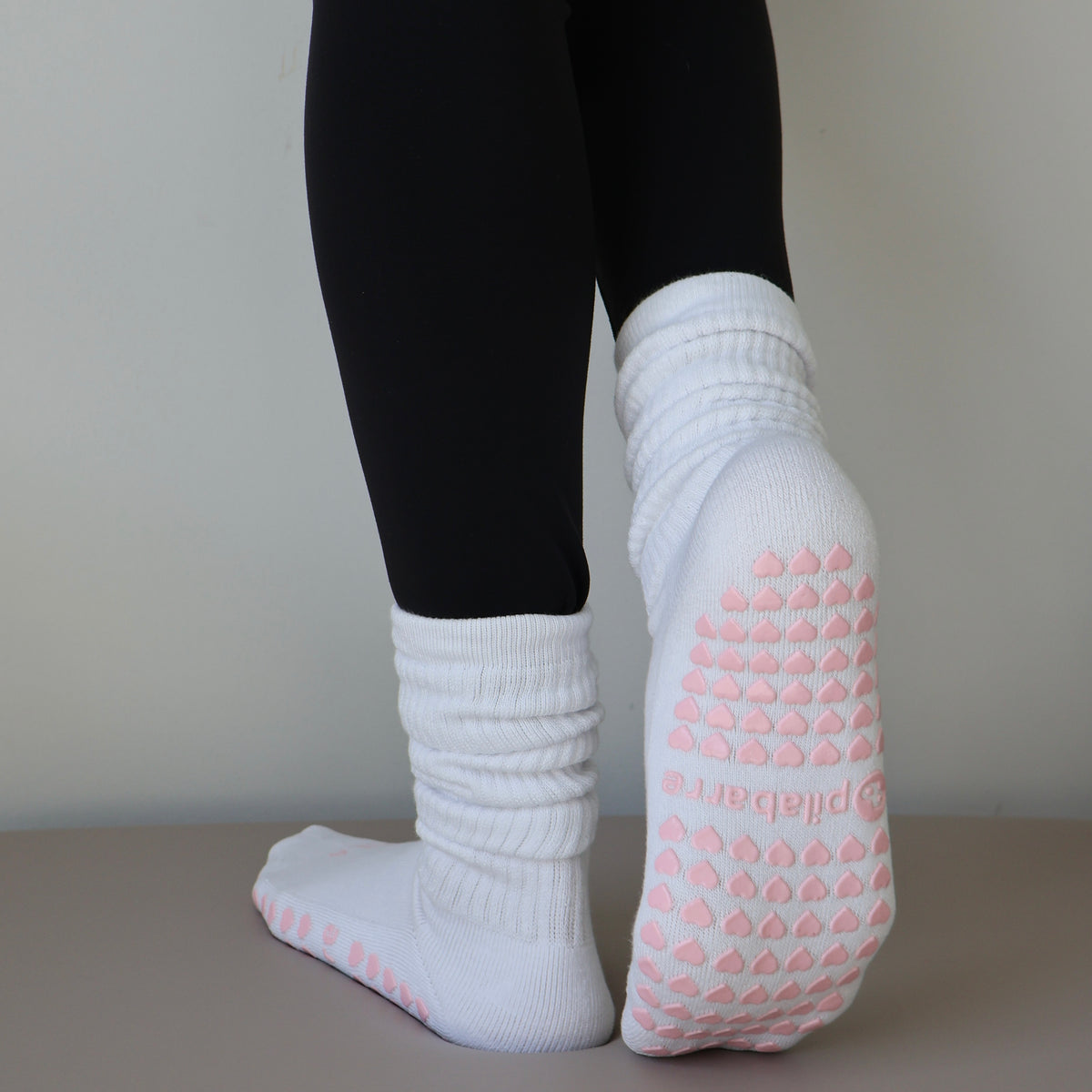 white scrunch barre socks with pink details