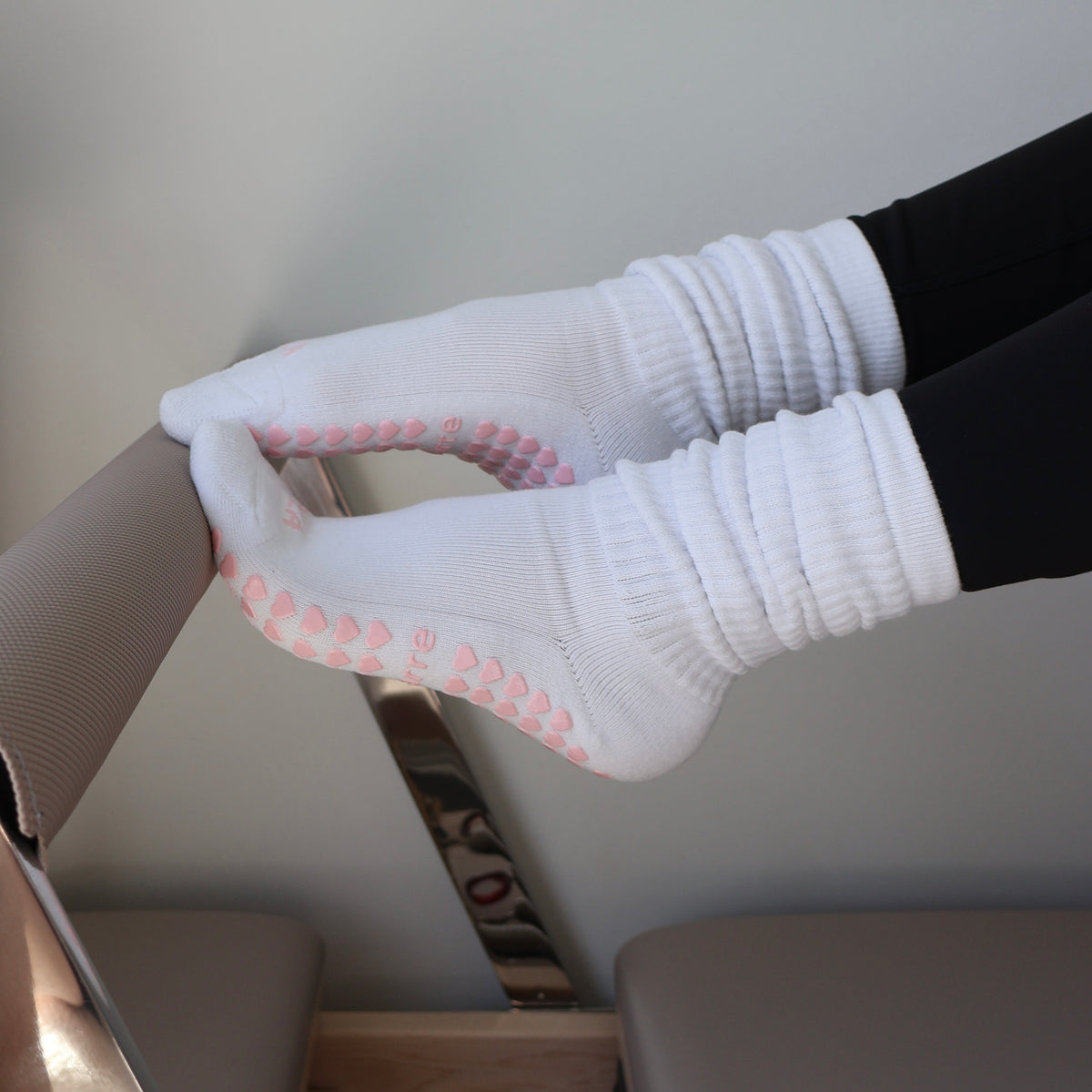 white scrunch grip socks with pink details