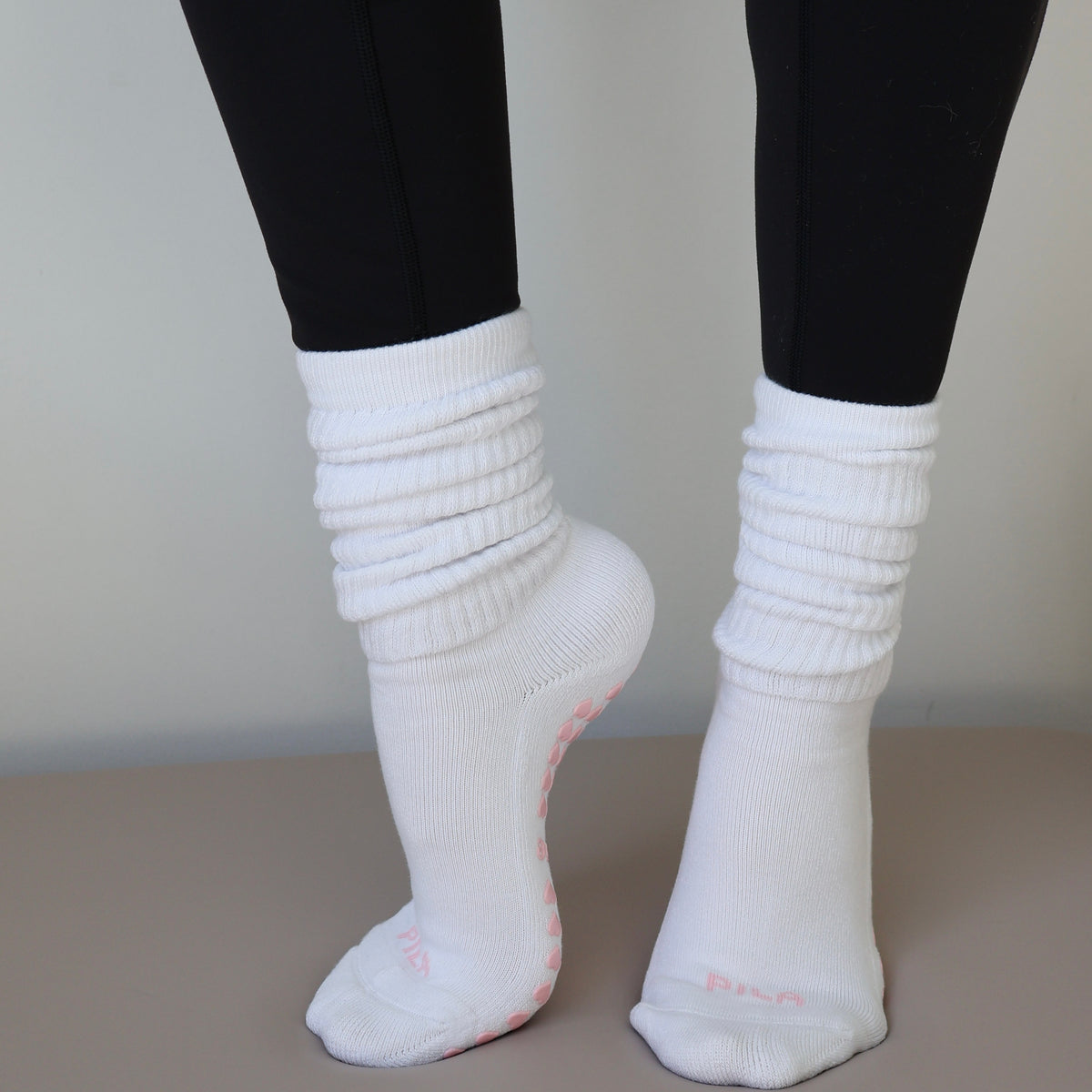 white scrunch grip socks with pink grips