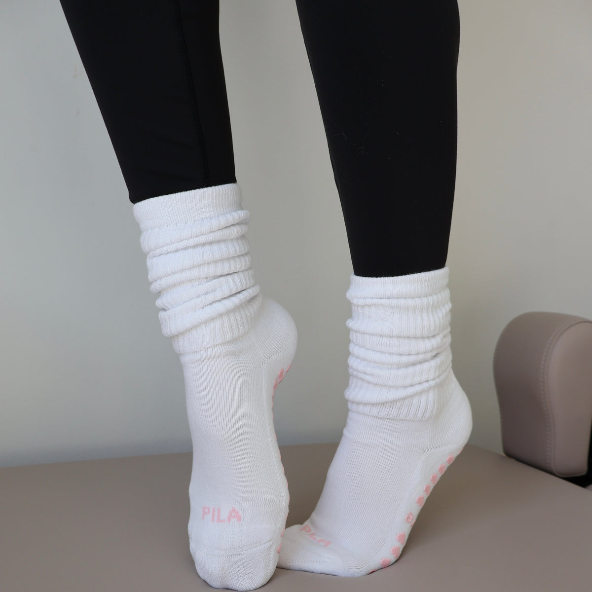 white scrunch pilates socks with pink details